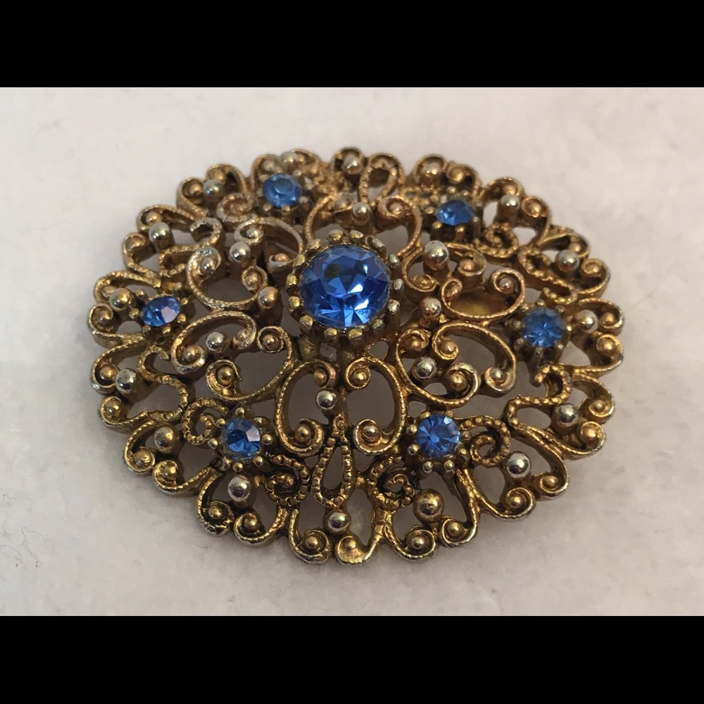 VTG JJ Jewelry Gold tone whirls Blue stones brooch